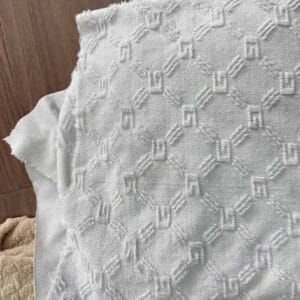 High-density weft-knitted jacquard